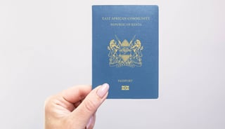 Hand holding a Kenyan passport