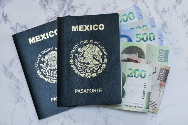 A High Angle View Of Two Mexican Passports And Pesos On The Table Under The Lights