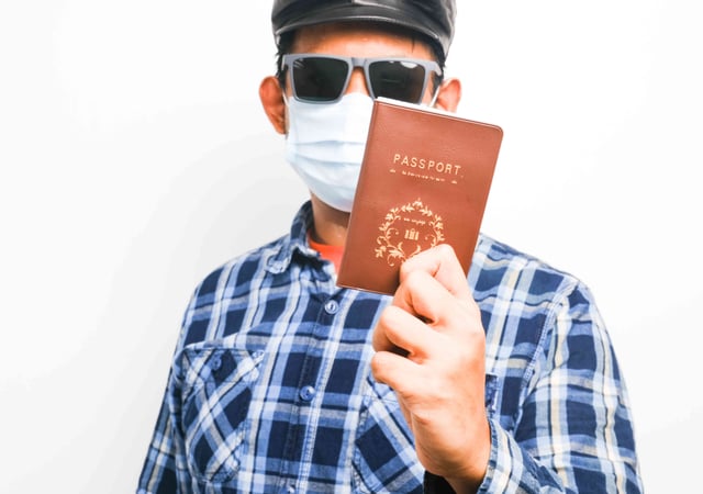 A Picture Of Men Holding Passport