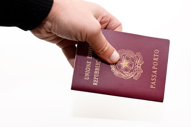 Hand showing the Italian passport