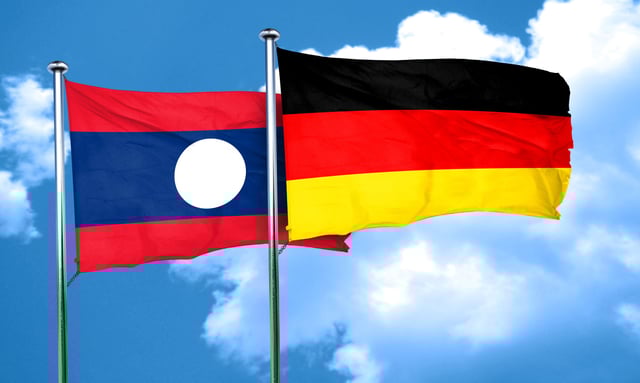 Laos And Germany Flags Waving Together