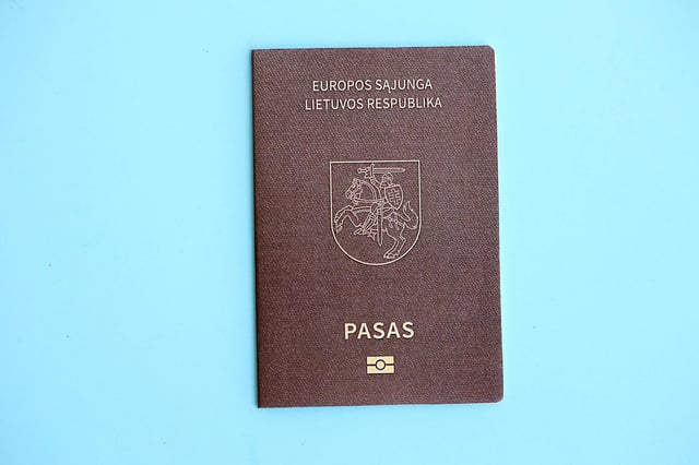 Lithuania Passport On Light Blue Paper Background