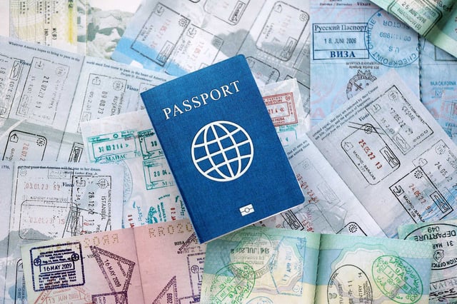 Passport On Top Of Open Passports